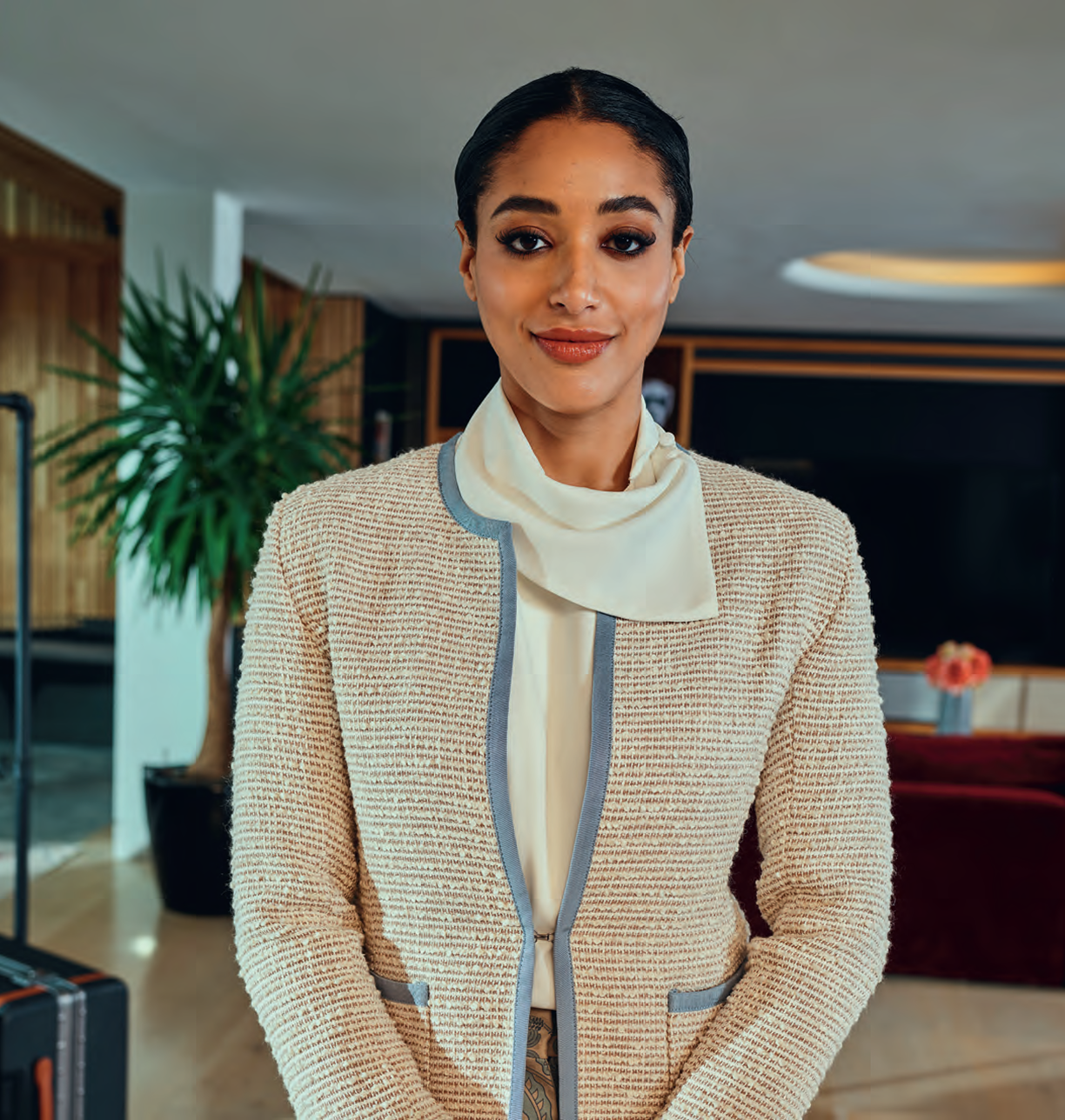 Woman in elegant tweed uniform jacket